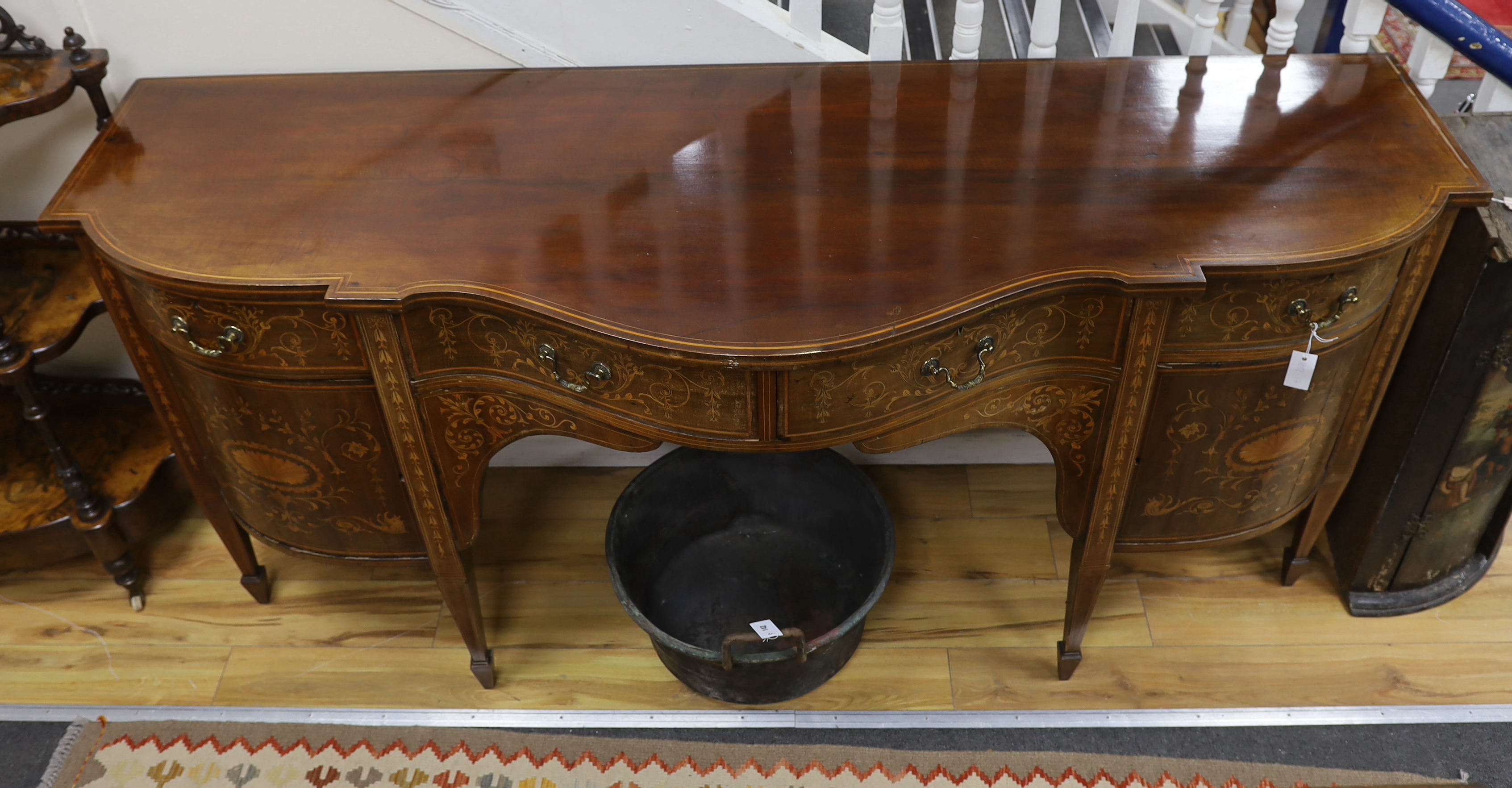 An Edwardian marquetry inlaid mahogany bow front sideboard, width 215cm, depth 73cm, height 95cm
